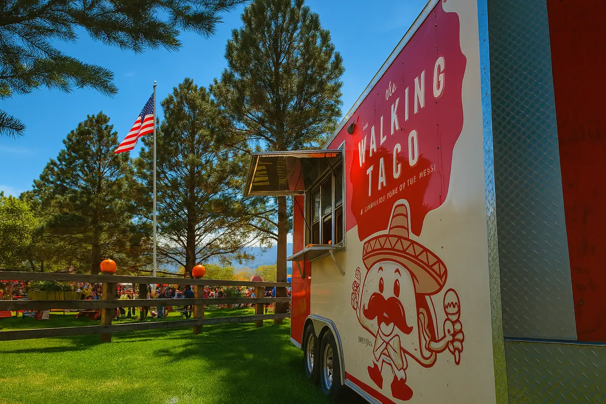 Food truck team serving walking tacos and street tacos to guests at an outdoor event